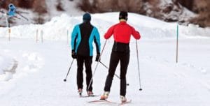 picture of two skiers on track