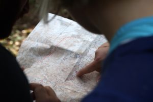 picture of two orienteers exploring map