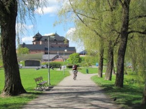 picture of a cyclist with Hame Castle in the background